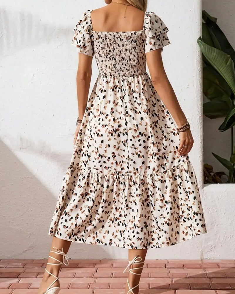 Dames midi jurk met print met flutter mouwen en geplooide rok