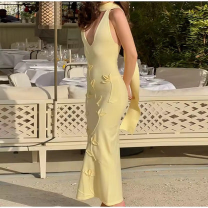 Dames mouwloze halterneck maxi jurk met strikapplicaties geel