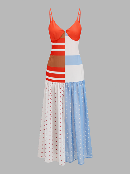 Vooraanzicht van midi slipdress met colorblock patchwork en stippenprint
