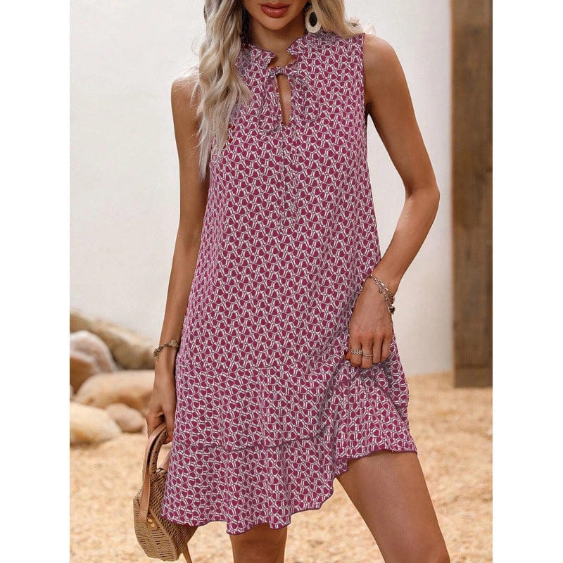 Dames midi jurk met geometrische print en strikdetail schuin van voren