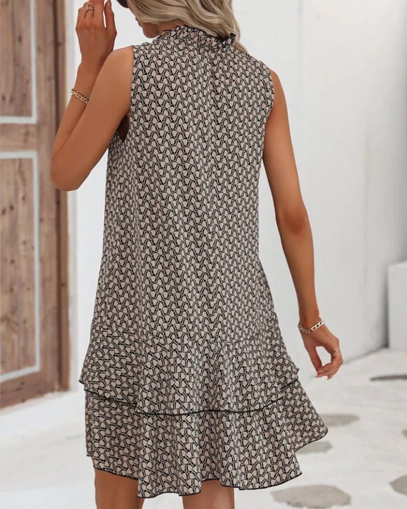 Dames jurk met geometrische print, detail van stof en pasvorm