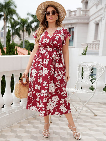 Midi-jurk met overslaghals, bloemenprint, strikceintuur en grote maten, rood