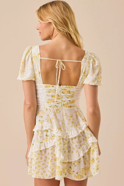 Minijurk met bloemmotief, kanten patchwork, V-hals en pofmouwen
