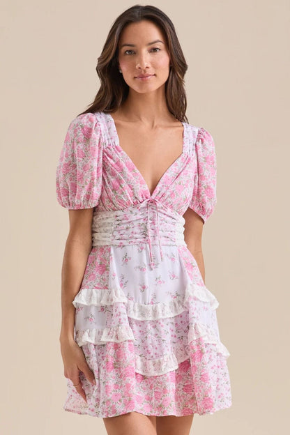 Minijurk met bloemmotief, kanten patchwork, V-hals en pofmouwen
