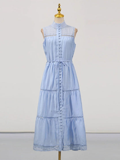 Mouwloze midi-jurk met oogjesstof en open details