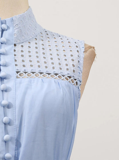 Mouwloze midi-jurk met oogjesstof en open details
