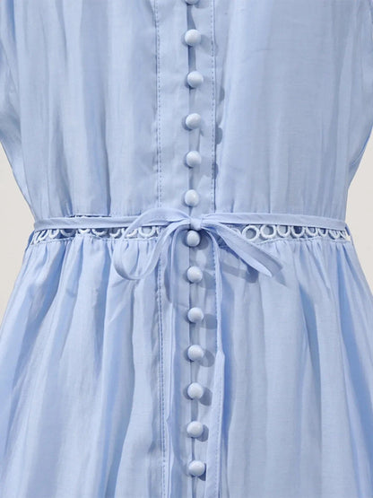 Mouwloze midi-jurk met oogjesstof en open details