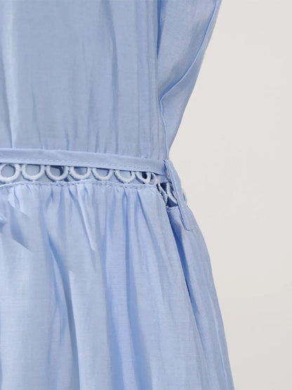 Mouwloze midi-jurk met oogjesstof en open details