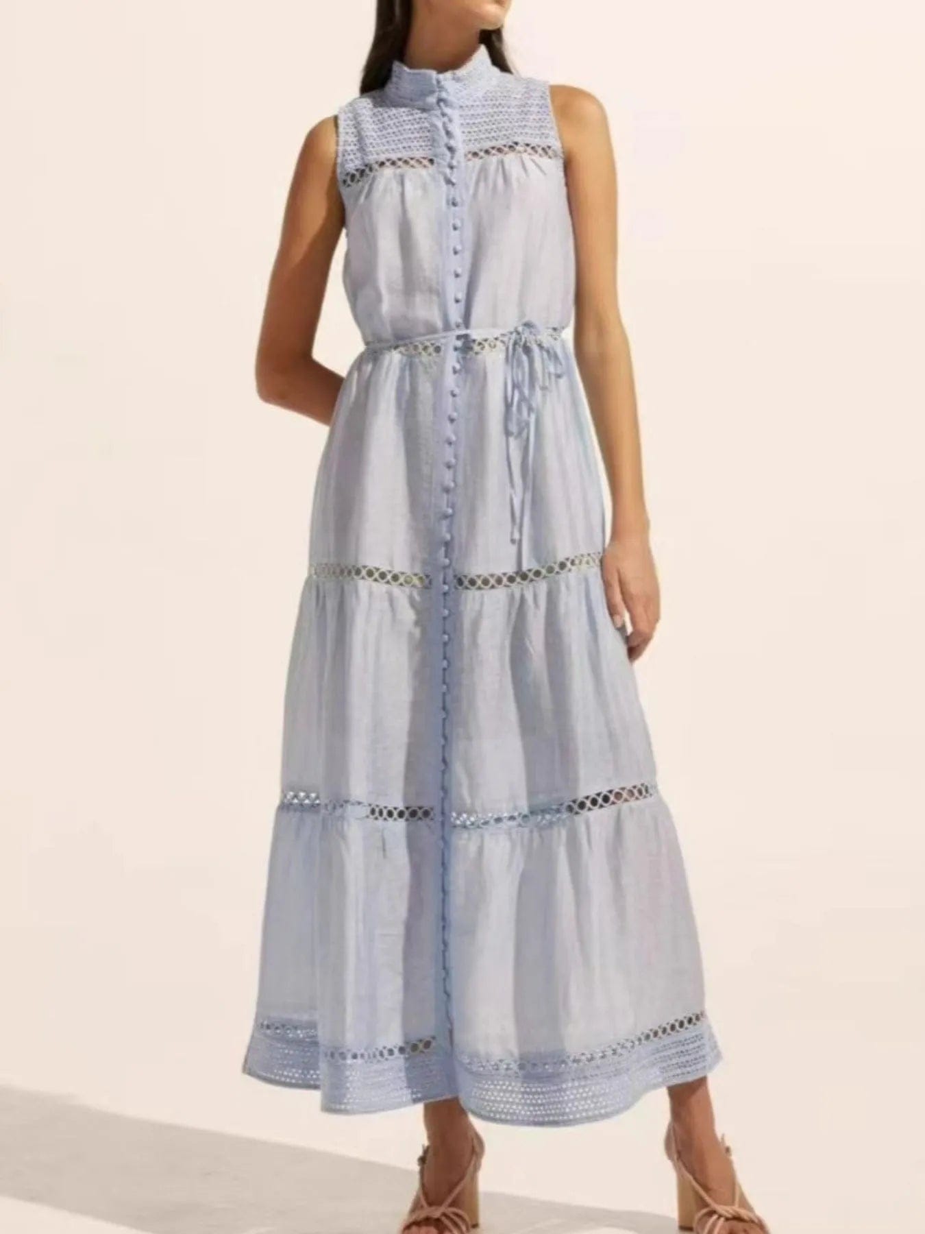 Mouwloze midi-jurk met oogjesstof en open details