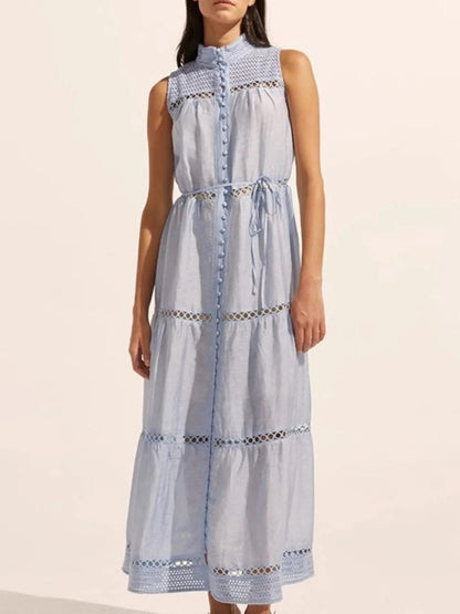 Mouwloze midi-jurk met oogjesstof en open details