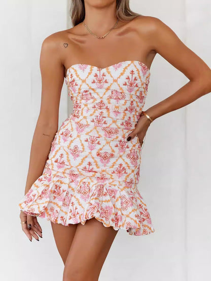 Zijaanzicht van de dames midi jurk met bloemenprint en plooien